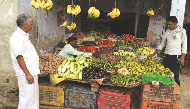 A villager buys vegetables at a shop in Uttar Pradesh. Indiau2019s consumer prices rose at a faster-than-expected pace to 6.07% last month from a year ago, up from Juneu2019s 5.77% annual gain, government data showed yesterday.