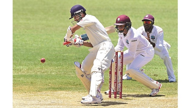 Ajinkya Rahane of India was unbeaten on 83 when rain halted play during the second day of the second Test at Sabina Park in Kingston, Jamaica. (AFP)