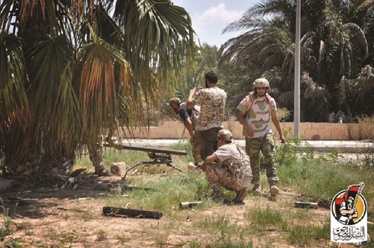Members of forces loyal to Libyau2019s unity government taking part in the military operations against the Islamic State group in Dollar neighbourhood in the centre of Sirte. US warplanes yesterday carried out air strikes on positions of the Islamic State group in Sirte for the first time.