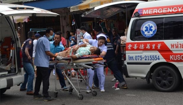 The injured receive first aid after a bomb exploded in Trang, Thailand.