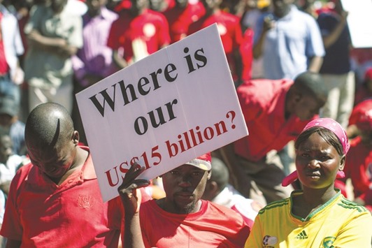Supporters of Zimbabweu2019s opposition party Movement for Democratic Change (MDC) shout anti-government slogans during a demonstration yesterday in Gweru. MDC leader Morgan Tsvangirai led the demonstration against state corruption and the countryu2019s economic collapse that has left government struggling to pay its workers.