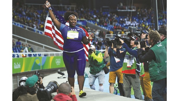 Michelle Carter of the United States stunned defending champion Valerie Adams of New Zealand with her very last throw to win the gold medal in the womenu2019s shot put on Friday night at the Olympic Stadium. (AFP)