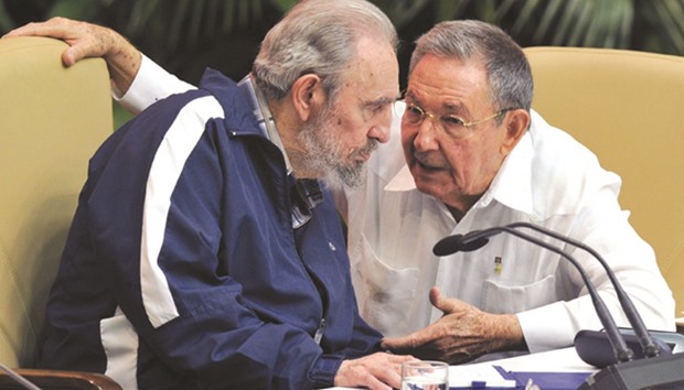 An April 21, 2011, file photo of former Cuban president Fidel Castro listening to his brother Raul at the Convention Palace in Havana.