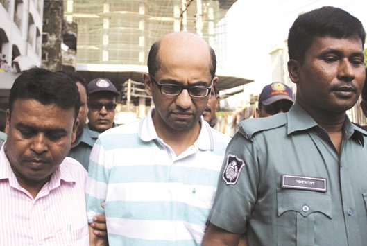 British national Hasnat Karim (centre) leaves after his court appearance in Dhaka yesterday.