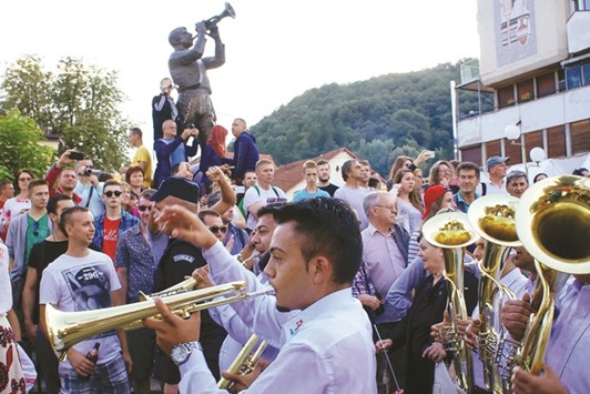 A brass band performs during the 56th annual trumpet and brass band festival in Guca town.