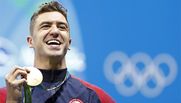USA's Anthony Ervin poses with his gold medal