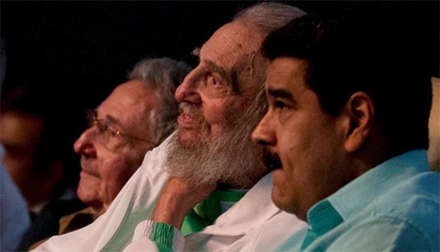 Former Cuban leader Fidel Castro (centre), Cuba's President Raul Castro (left) and Venezuela's President Nicolas Maduro attend a gala for Fidel Castro's 90th birthday at the Karl Marx theatre in Havana on Saturday.