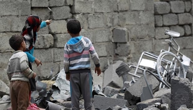 Yemeni children stand amidst the rubble of a house in Sanaa last Thursday after it was reportedly hit by a Saudi-led coalition air strike.