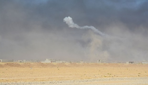 Smoke rises from clashes between Iraqi army and Islamic State militants, south of Mosul, August 12, 2016.