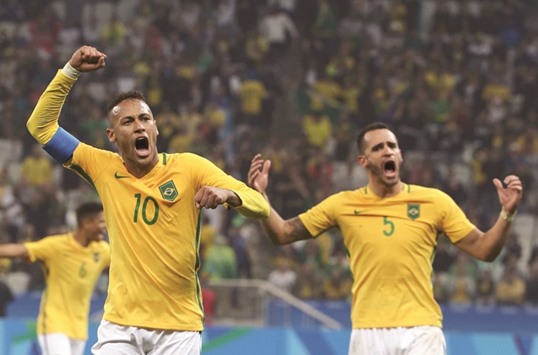 Neymar celebrates Brazilu2019s 2-0 victory over Colombia with teammate Renato Augusto. (Reuters)