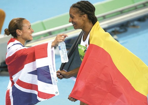 Ennis-Hill (left) of Britain congratulates Nafissatou Thiam of Belgium for winning the heptathlon gold. (Reuters)