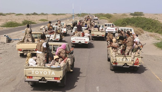 Yemeni pro-government forces ride military vehicles, as they head to Zinjibar, the capital of Yemenu2019s southern province of Abyan, to launch an offensive to recapture the town from Al Qaeda fighters yesterday.