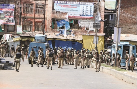 Security personnel secure the area during an encounter with militants, who attacked security patrol in Srinagar, killing a CRPF commandant and injuring nine paramilitary troopers and a local policeman.