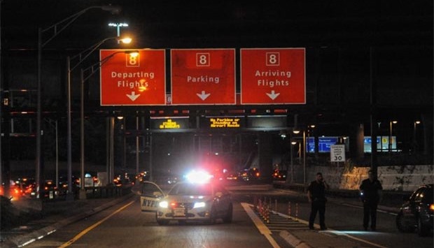 Members of the New York City Police Department block vehicle access to Terminal 8 at John F. Kennedy airport in the Queens borough of New York City on Sunday.