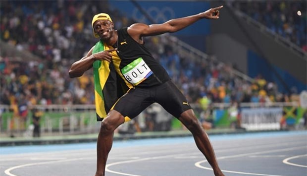 Jamaica\'s Usain Bolt celebrates after he won the men\'s 100m athletics final at the Rio 2016 Olympic Games.