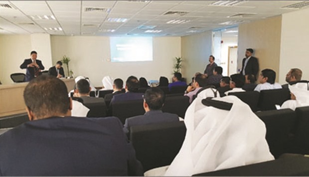 Participants listening to an expert during the cybersecurity workshop by Ooredoo and the QCB.