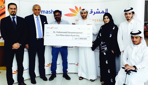 The winner is seen with Mashreq Qatar officials