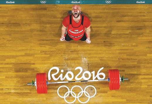 Ruslan Nurudinov (UZB) of Uzbekistan celebrates winning the gold medal in the Menu2019s 105kg category at the Riocentro in Rio de Janeiro.
