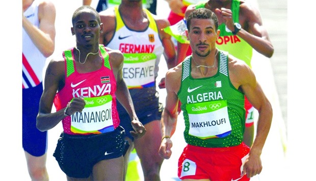 Algeriau2019s Taoufik Makhloufi (right) competes in the menu2019s 1,500m Round 1 at the Olympic Stadium in Rio de Janeiro yesterday. (AFP)