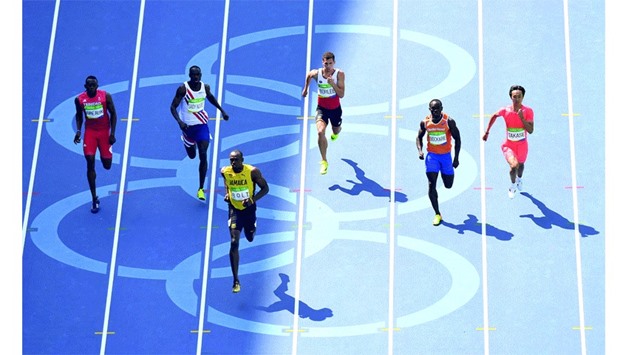 Jamaicau2019s Usain Bolt (third from left) competes in the menu2019s 200m Round 1 at the Olympic Stadium in Rio de Janeiro yesterday. (AFP)