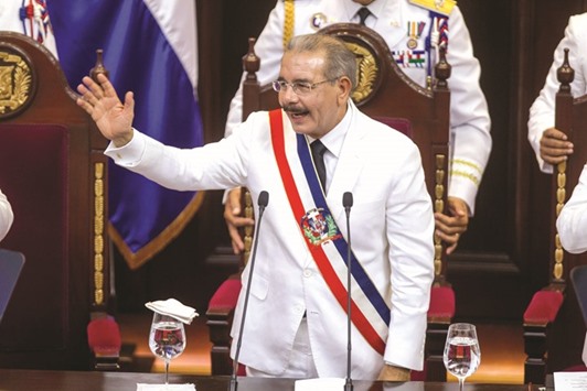 Dominican Republic President Danilo Medina acknowledges lawmakersu2019 applause after receiving the presidential sash at the national congress in Santo Domingo.