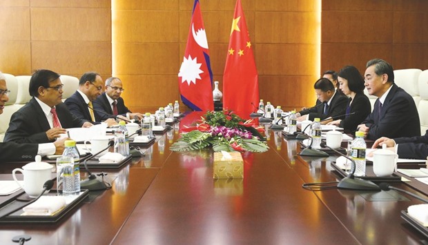 Chinese Foreign Minister Wang Yi (right) speaks with Nepal Premieru2019s special envoy Krishna Bahadur Mahara (left) during their meeting at the Ministry of Foreign Affairs in Beijing yesterday.