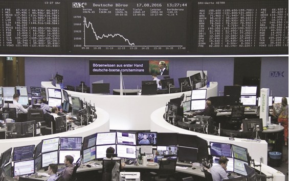 Traders at the Frankfurt Stock Exchange. The DAX 30 lost 1.3% to 10,537.67 yesterday.