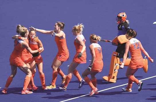 The Netherlands players celebrate after the penalty shoot-out win over Germany in the hockey semi-final yesterday. (AFP)
