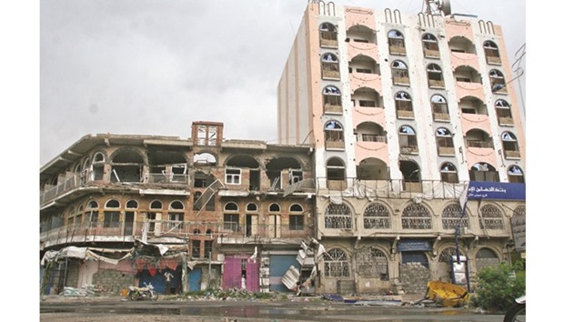 Damaged buildings are pictured in the war-torn southwestern city of Taiz, Yemen, yesterday.