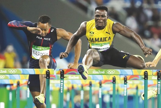 Jamaicau2019s Omar McLeod crosses a hurdle on his way to a gold in the 110m hurdles final in Rio de Janeiro on Tuesday. (Reuters)
