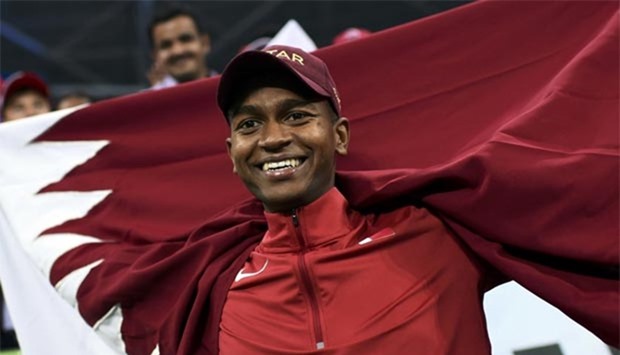 Qatar\'s Mutaz Essa Barshim celebrates his silver medal win in the men\'s high jump.