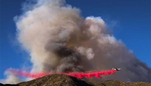 An air tanker drops fire retardant on the Blue Cut wildfire in Lytle Creek, California.