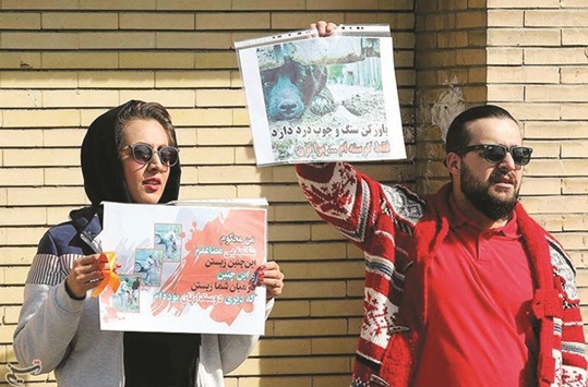 Demonstrators take part in a protest against animal cruelty in Mashad, Iran.