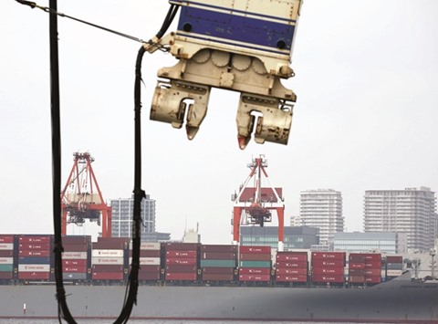 A cargo ship at an industrial port in Tokyo. In July Japanu2019s exports fell an annual 14%, which matched the median estimate in a Reuters poll of economists and was the fastest decline since October 2009.