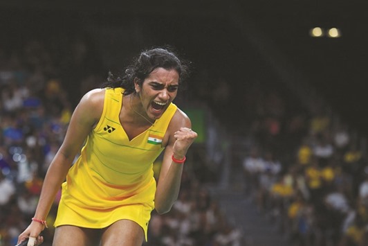 Indiau2019s PV Sindhu celebrates after beating Japanu2019s Nozomi Okuhara in their womenu2019s semi-final badminton at the Riocentro Stadium in Rio de Janeiro yesterday. (AFP)