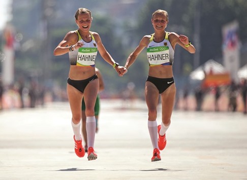 German twins Anna (left) and Lisa Hahner finish the Marathon final. (Reuters)