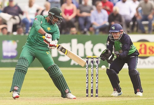Pakistanu2019s Sharjeel Khan (left) plays a shot on the way to scoring a century during the first ODI against Ireland in Dublin yesterday; (below) Imad Wasim picked five wickets. (AFP)