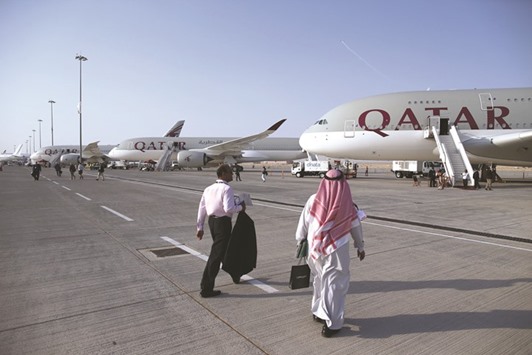 Qatar Airways aircraft on display on the opening day of the 14th Dubai Air Show at Dubai World Central. Qatar Airways has added at least 29 planes to its fleet since moving to a new airport in 2014, a facility it plans to expand before the World Cup.