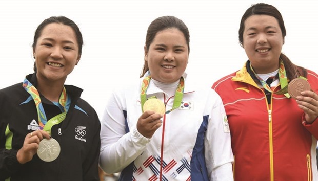 (From Left) Womenu2019s golf silver medal winner New Zealandu2019s Lydia Ko, South Koreau2019s Park In-Bee (gold) and Chinau2019s Feng Shanshan (bronze) pose on the podium after the end of the Olympic Games womenu2019s golf competition yesterday. (AFP)