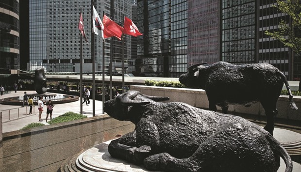 Bull statues displayed outside the Hong Kong Stock Exchange. The bourse will  introduce a measure designed to help deal with extreme price swings on its stock market this week.