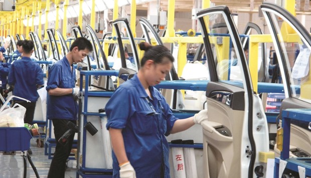 Employees work at a production line inside a factory of Saic GM Wuling, in Liuzhou. Chinau2019s auto market has recovered from a mixed 2015 when sales overall fell each month from April through August.
