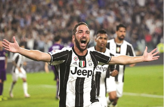 Juventusu2019 Gonzalo Higuain celebrates after scoring against Fiorentina during their Serie A match.