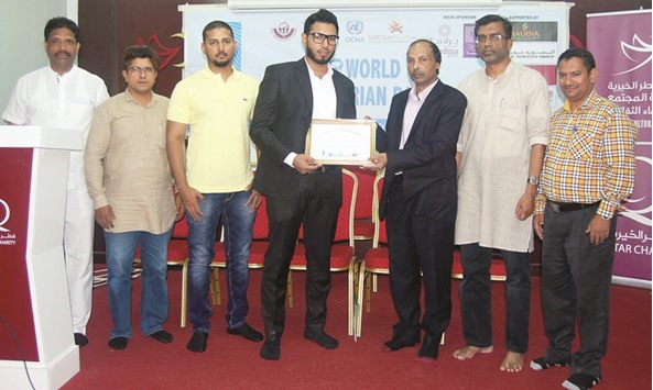 PITCHING IN:  Mohamed Hafiz, executive director of Bradma Group, left, receiving a memento on the occasion.