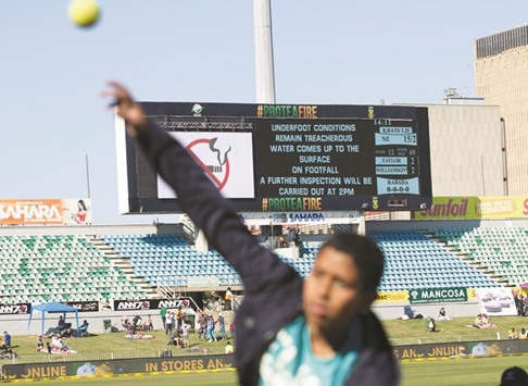 Children play cricket on the sidelines after the play was abandoned in Durban yesterday.