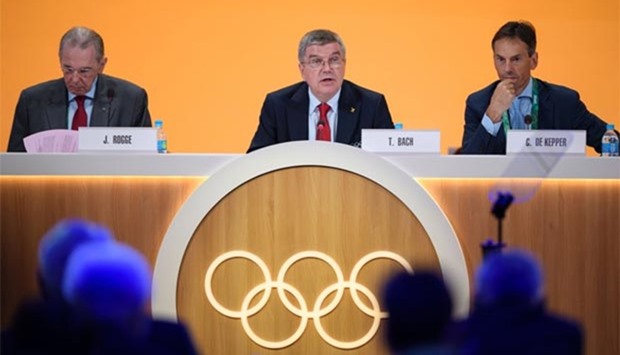 International Olympic Committee president Thomas Bach looks on next to former IOC president Jacques Rogge (left) and IOC Director General Christophe De Kepper (right) during the 129th International Olympic Committee session, in Rio de Janeiro on Tuesday.