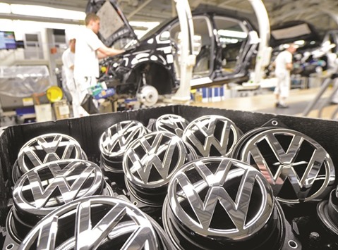 Emblems of VW Golf VII car are seen in a production line in Wolfsburg. South Korea said yesterday it would block sales of 80 VW models and fine the company 17.8bn won ($16mn) because the carmaker fabricated documents related to emissions and noise-level tests.