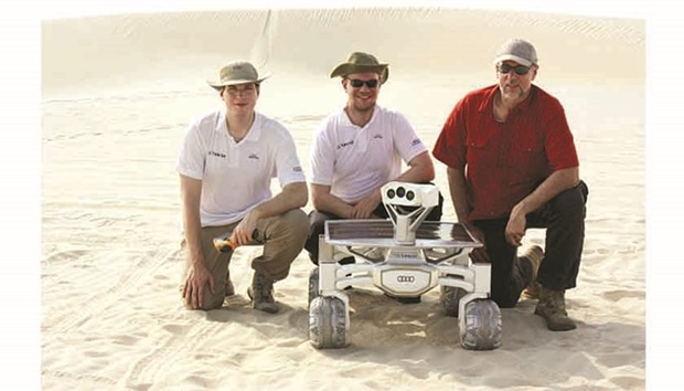 The Part-Time scientists team with the Audi Lunar quattro moon rover during the recent testing in the Qatari desert.