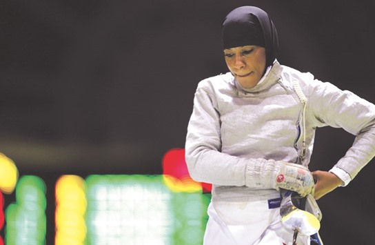 This file photo taken on November 09, 2010 shows US Ibtihaj Muhammad reacting as she competes against France for the bronze medal during the Fencing World championships womenu2019s team saber match at the Grand Palais in Paris.