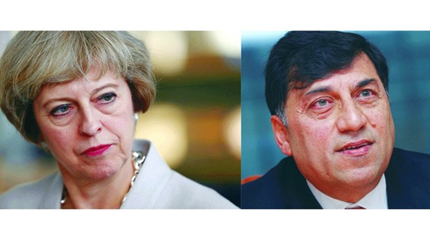 Prime Minister Theresa May and  Reckitt Benckiser CEO Rakesh Kapoor.