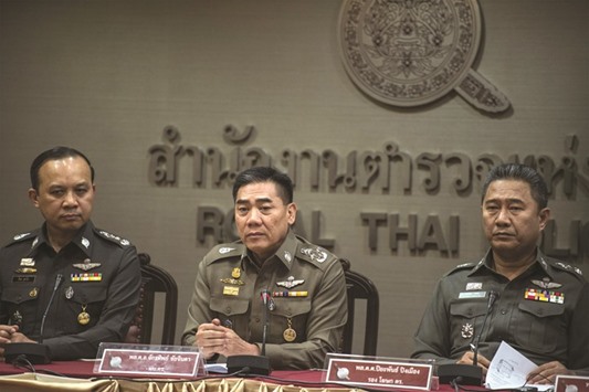 Royal Thai police chief Chakthip Chaijinda (centre) speaks in a weekly press conference at the police headquarters in Bangkok yesterday.